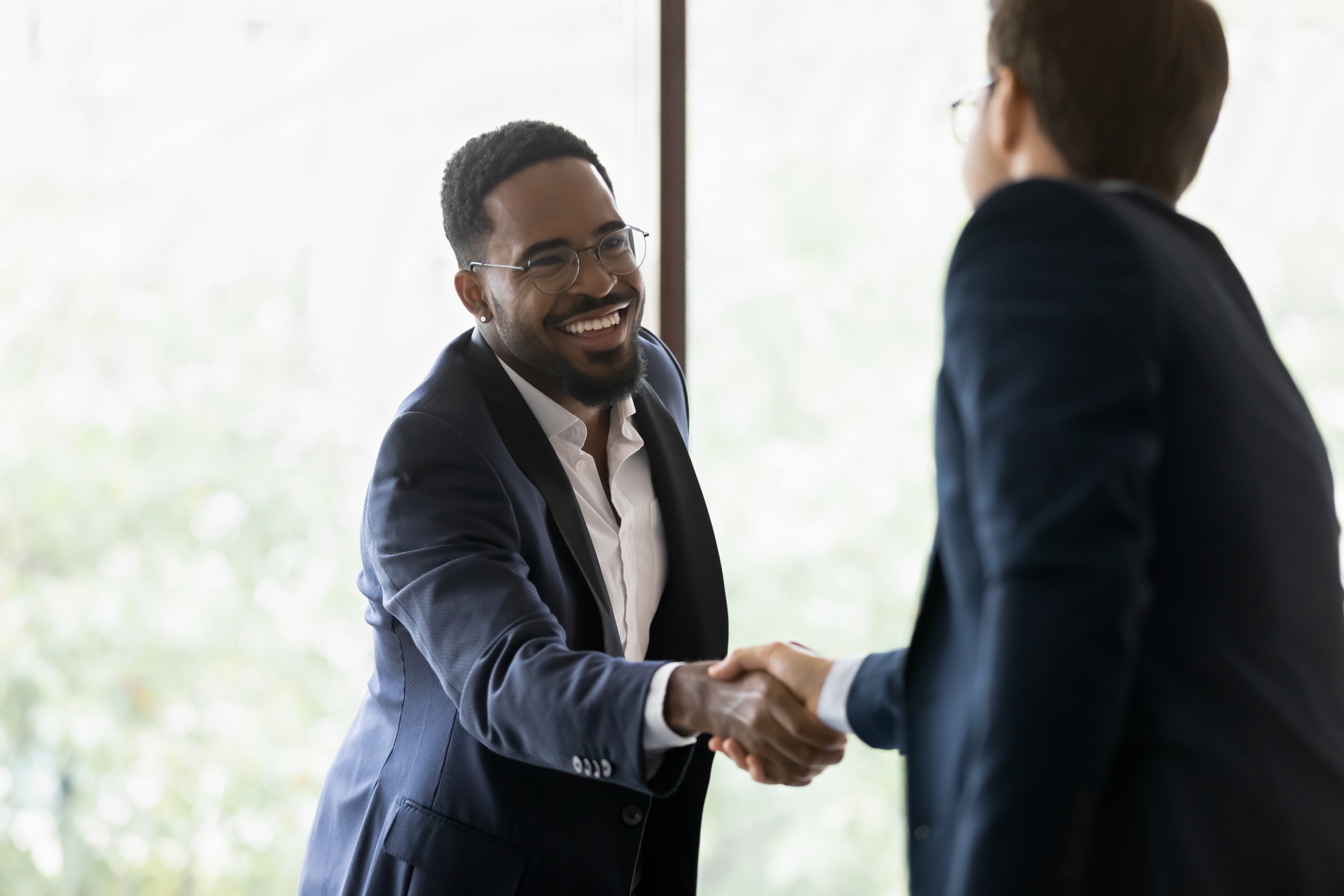 Good,Deal.,Happy,African,American,Businessman,Handshaking,With,Caucasian,Partner