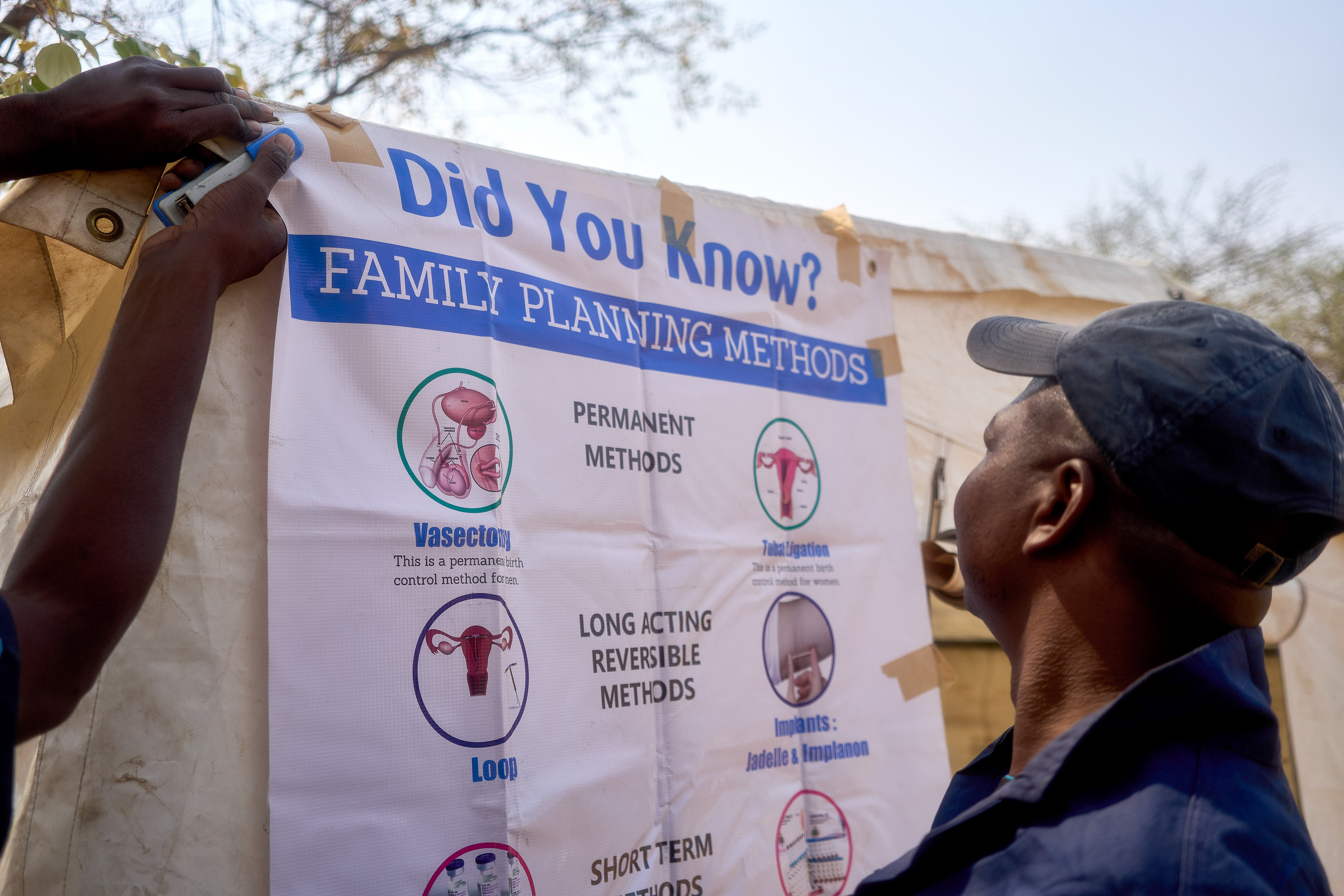 A man looking at family planning method options